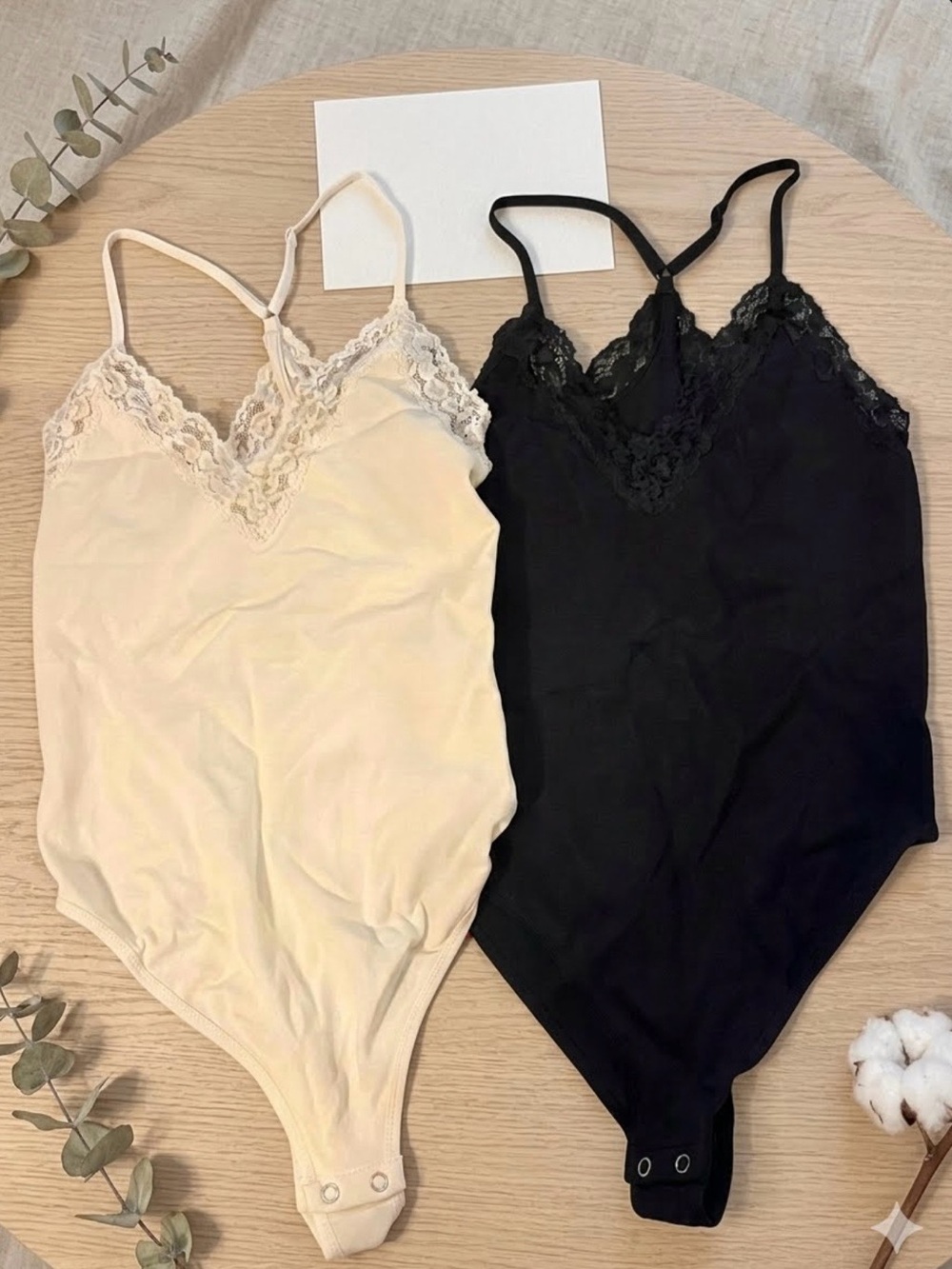 2 seamless lace-trim bodysuits from Forever 21 black and white size M/L NWT